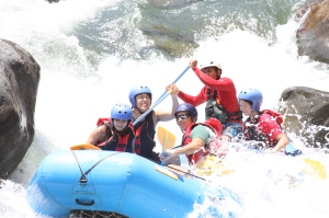 We crash through a bumpy rapid, laughing and getting soaked at the same time!